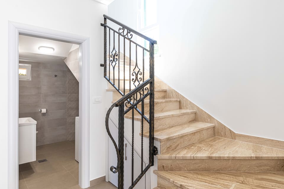 Stone staircase with wrought-iron rail