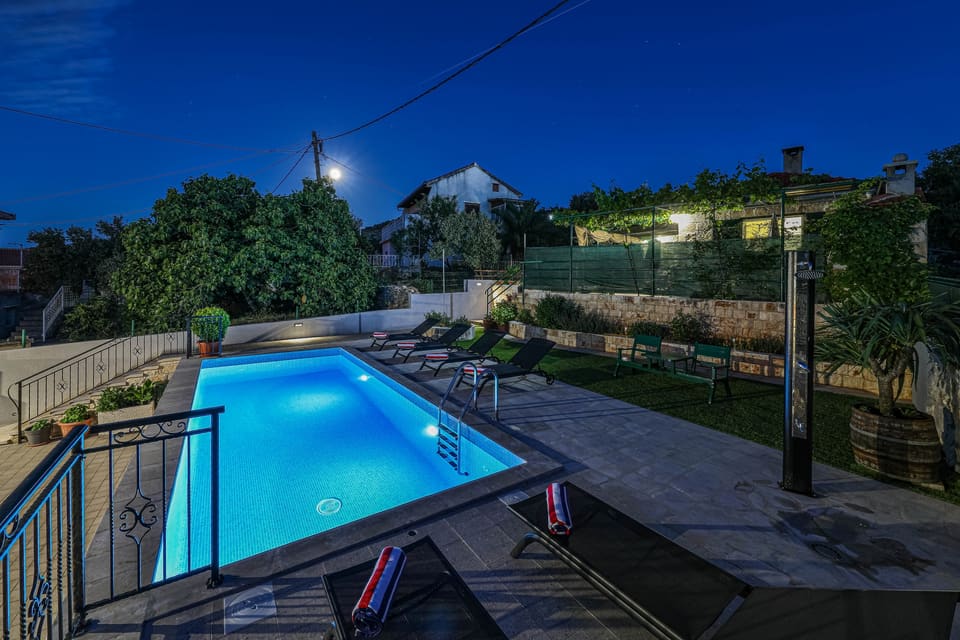 The stone tower and pool at dusk